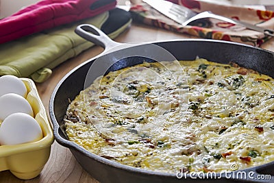 Homemade frittata made with broccoli, bacon, spinach and mushrooms Stock Photo