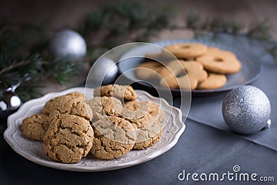 Homemade ginger and oats biscuits on a decorative plate with pin Stock Photo