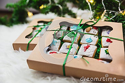 Homemade gingerbread christmas cookies advent calendar on white background in gift boxes Stock Photo