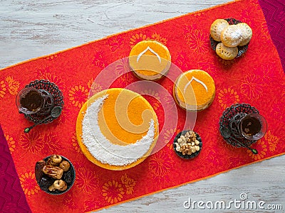 Homemade golden cake with a Crescent moon, served with tea cup and dates. Ramadan background Stock Photo