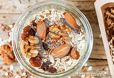 Homemade granola with almonds, walnuts, raisins and flax seeds Stock Photo