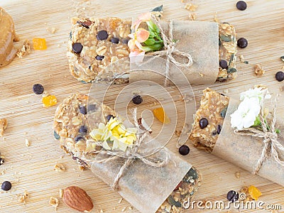 Homemade granola bars with peanut butter and chocolate chips on wooden table, healthy vegan snacks Stock Photo