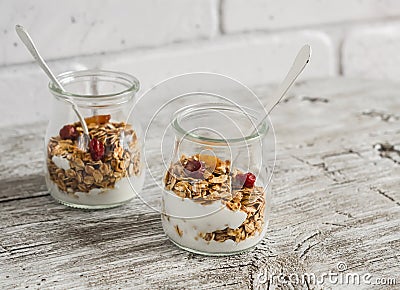 Homemade granola and natural yoghurt on a light wooden surface. Healthy food, healthy Breakfast Stock Photo