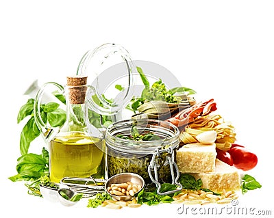 Homemade green pesto sauce and ingredients on white Stock Photo