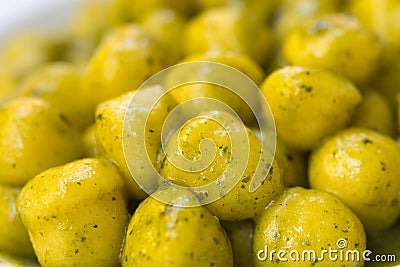 Homemade handmade Italian potato gnocchi pasta with basil pesto Stock Photo