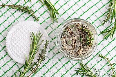 Homemade herbal scrub foot soak or bath salt with rosemary, thyme, sea salt and olive oil. Natural skin and hair care. Stock Photo