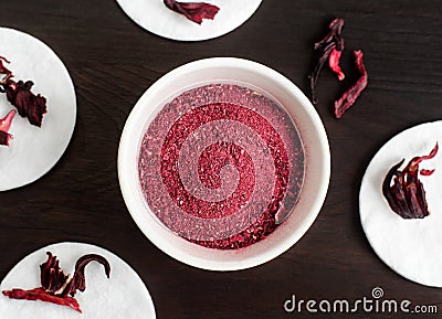 Homemade hibiscus powder for preparing face and body mask or exfoliating scrub bath salts, foot soak. Stock Photo