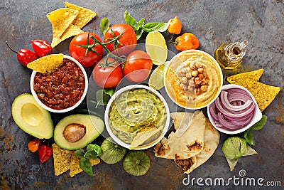 Homemade hummus, salsa and guacamole with corn chips Stock Photo