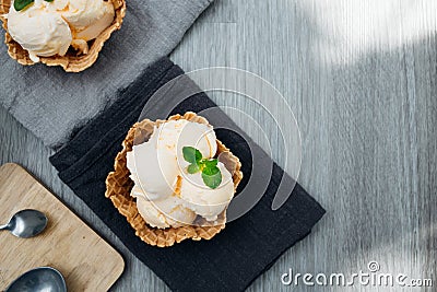 homemade Ice cream scoops with vanilla ice cream in a bowl with mint. Top view Stock Photo