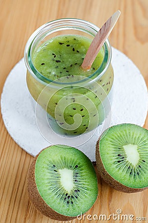 Homemade kiwi beauty mask scrub in a glass jar. DIY cosmetics and natural beauty treatment recipe Stock Photo