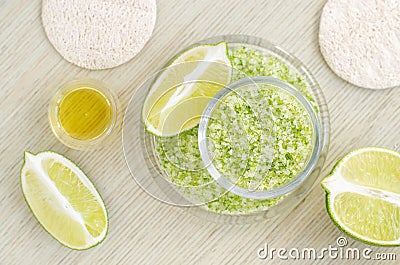 Homemade lime scrub with lime zest and juice, sea salt and olive oil. DIY beauty treatments and spa recipe. Stock Photo