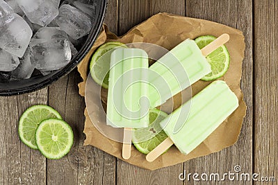 Homemade lime yogurt popsicles with fresh lime slices Stock Photo