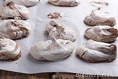 Homemade marble chocolate meringue cookies on a baking sheet Stock Photo