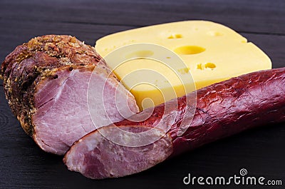 Homemade meat, sausage and cheese on a dark background Stock Photo