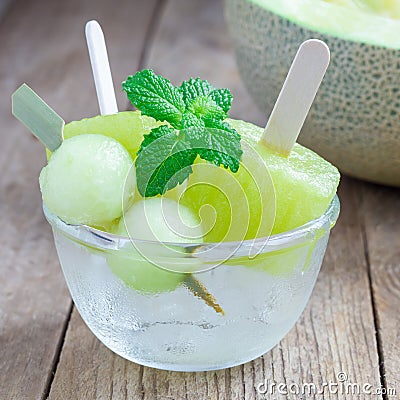 Homemade melon popsicles in the glass, closeup, square format Stock Photo