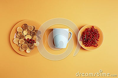 Homemade mini pancakes in an orange plate on an orange background Stock Photo