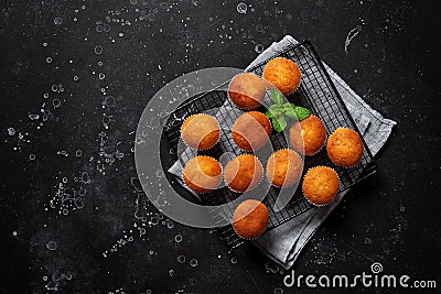 Homemade muffins. Black stone grunge background. Top view Stock Photo