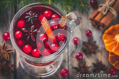 Homemade mulled wine with orange slices, cranberries, cinnamon and anise Stock Photo