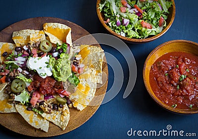 Homemade Nachos with tortilla chips cheese and guacamole Stock Photo