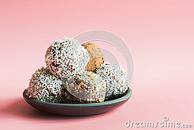 Homemade energy dates balls on pink background. Space for text Stock Photo