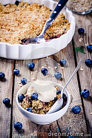 Homemade oatmeal blueberry crumble with ice cream Stock Photo