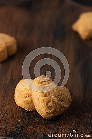 Homemade oatmeal cookies on the baked paper and dark wooden background, close up top view copy space Stock Photo