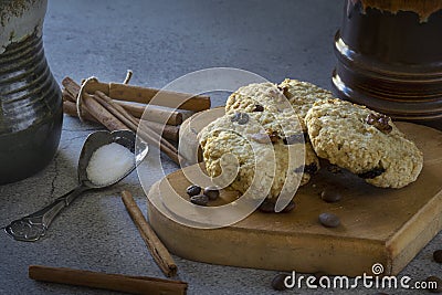 Homemade oatmeal raisin cookies with coffee beans and cinnamon sticks Stock Photo