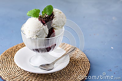 Homemade Organic Vanilla Ice Cream with Jam and Mint Blue Background Tasty Ice Cream Horizontal Copy Space Stock Photo