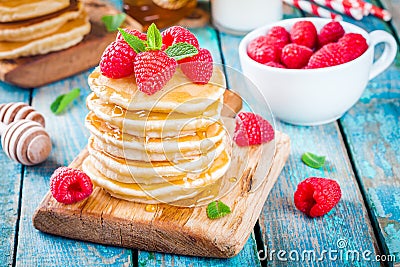 Homemade pancakes with honey and raspberry Stock Photo