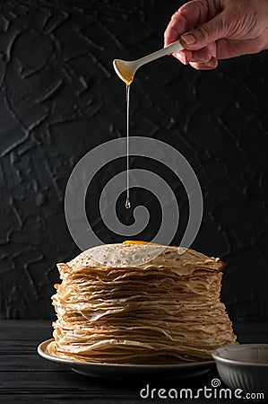 Homemade pancakes with honey and walnuts, vintage white plate, d Stock Photo