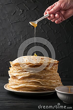 Homemade pancakes with honey and walnuts, vintage white plate, d Stock Photo