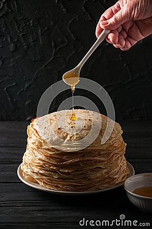 Homemade pancakes with honey and walnuts, vintage white plate, d Stock Photo