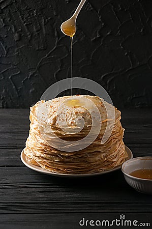 Homemade pancakes with honey and walnuts, vintage white plate, d Stock Photo