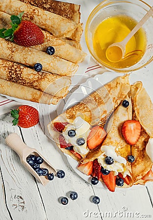 Homemade pancakes with wipped cream and fresh berries Stock Photo