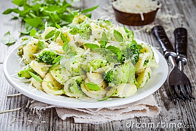 Homemade pasta orecchiette with broccoli, Parmesan cheese and basil Stock Photo