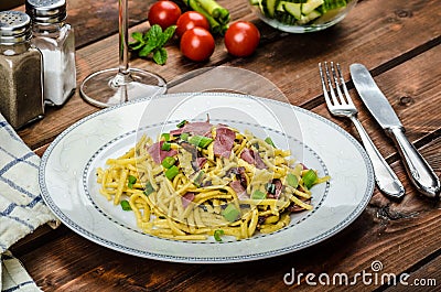 Homemade pasta with roasted Black Forest ham Stock Photo