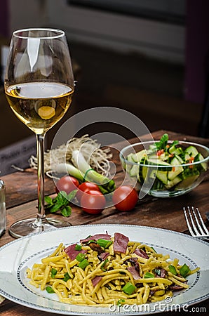 Homemade pasta with roasted Black Forest ham Stock Photo