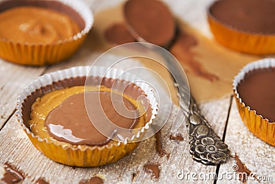 Homemade peanut butter cups on a rustic table Stock Photo