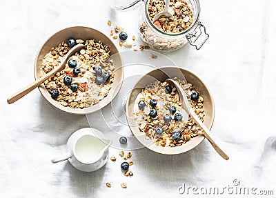 Homemade peanut butter granola with greek yogurt and blueberries on a light background, top view. Healthy energy breakfast or snac Stock Photo