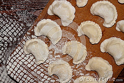 Homemade pierogi dumpling, traditional East European food before Stock Photo