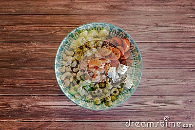 Homemade poke bowl with black Venus rice and salmon on a dark wooden table. Stock Photo