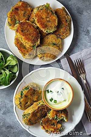 Homemade potato and spinach croquettes with yogurt dip. Stock Photo