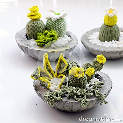 Homemade product for home decoration, group of succulent, cactus crochet in cement pot on white background Stock Photo