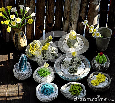 Homemade product for home decoration, group of succulent, cactus crochet in cement pot on wooden background Stock Photo