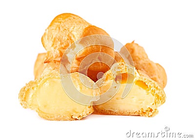 Homemade profiteroles with cream,isolated on a white background. Fresh baked golden profiterole. Custard cake Stock Photo