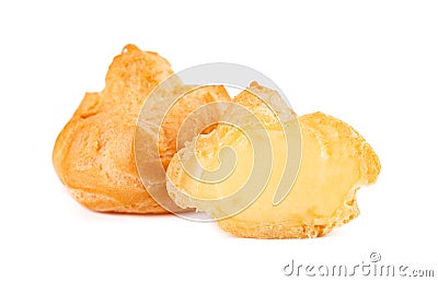Homemade profiteroles with cream,isolated on a white background. Fresh baked golden profiterole. Custard cake. Stock Photo