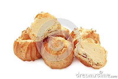 Homemade profiteroles with cream isolated on a white background. Fresh baked golden profiterole Stock Photo