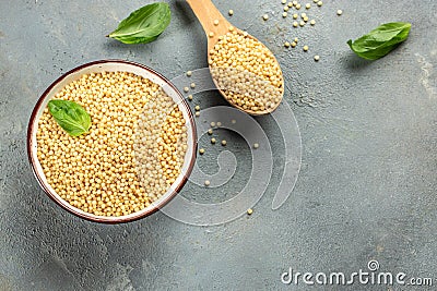 Homemade ptitim pasta in bowl on a light background top view. copy space Stock Photo
