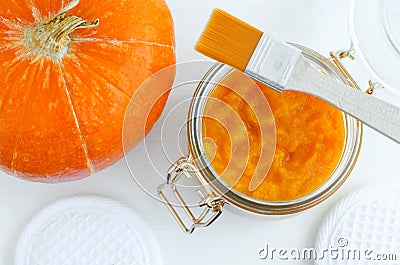 Homemade pumpkin face mask in a glass jar. DIY cosmetics and spa. Top view, copy space. Stock Photo