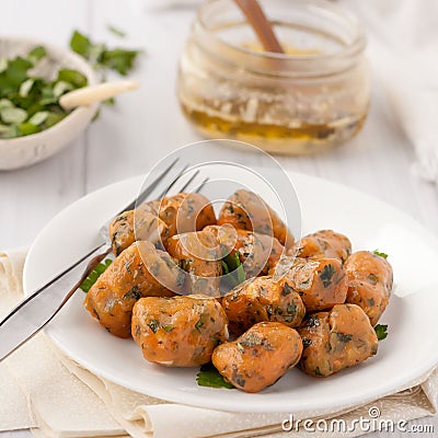 Homemade pumpkin gnocchi with sage butter Stock Photo